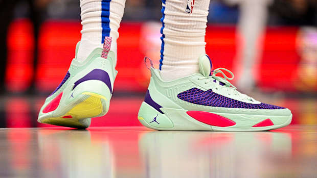 View of Luka Doncic's green and purple Jordan shoes.